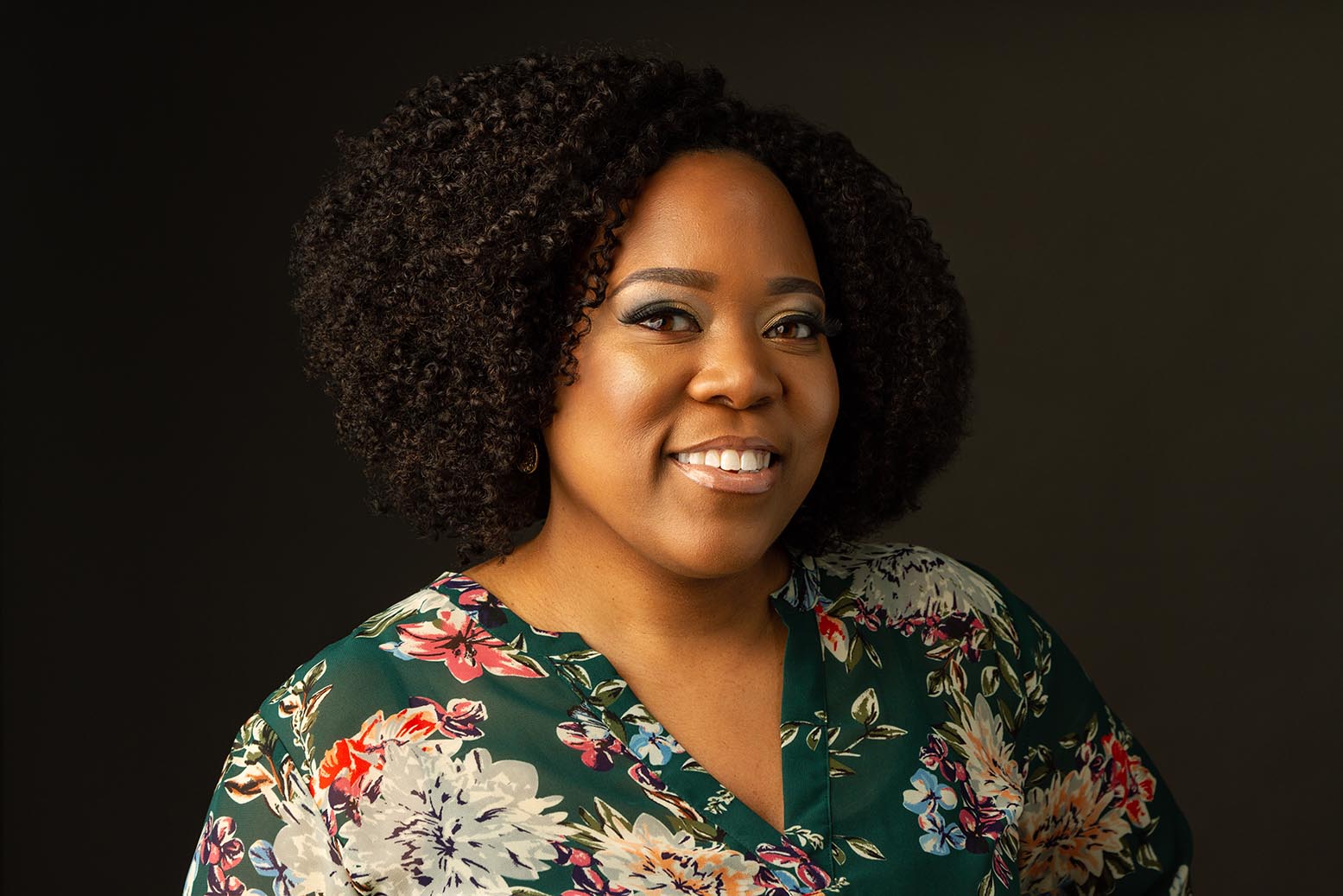 headshot of an entrepreneur and curly hair specialist