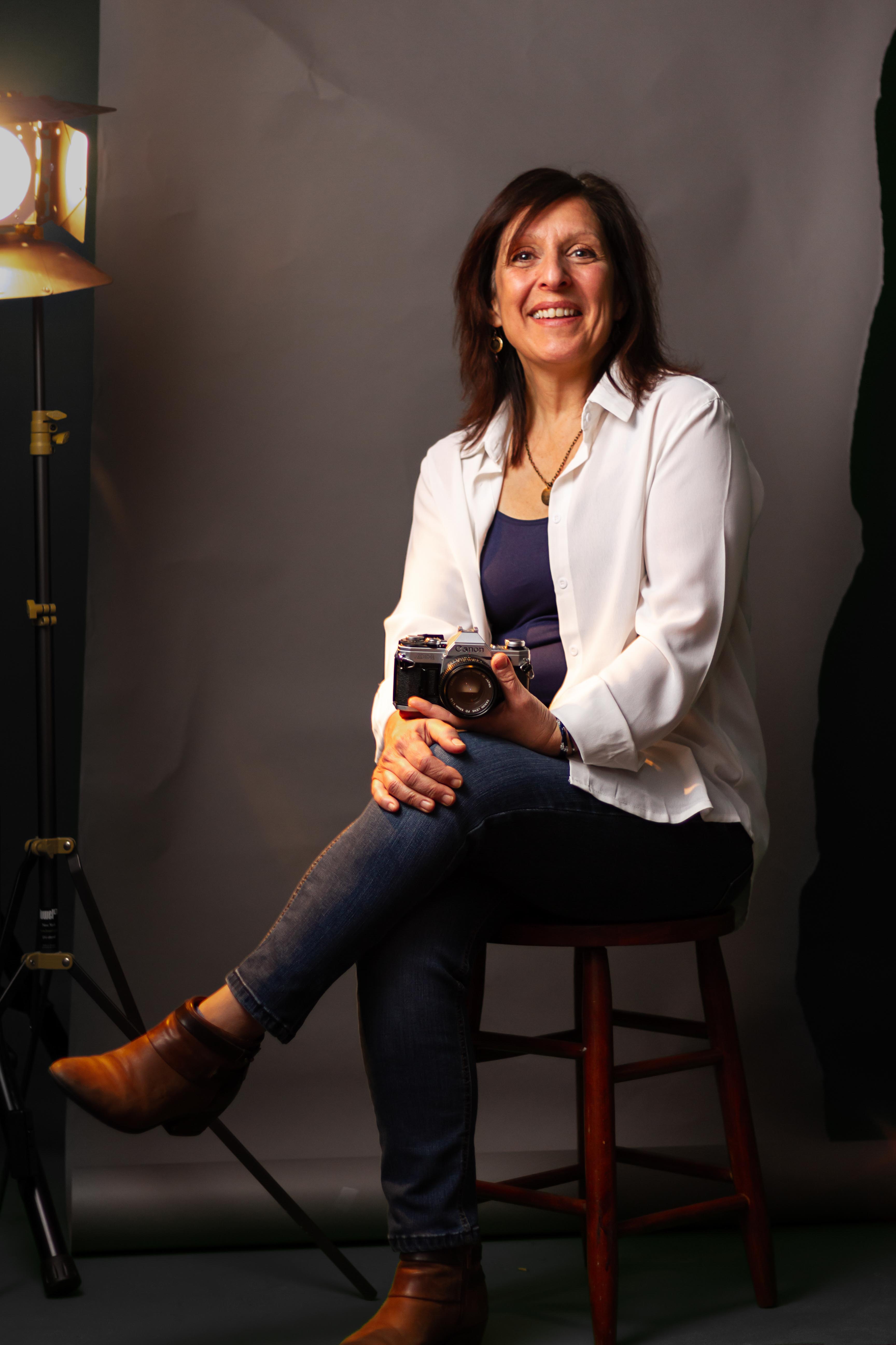 film photographer poses with a 35mm film camera